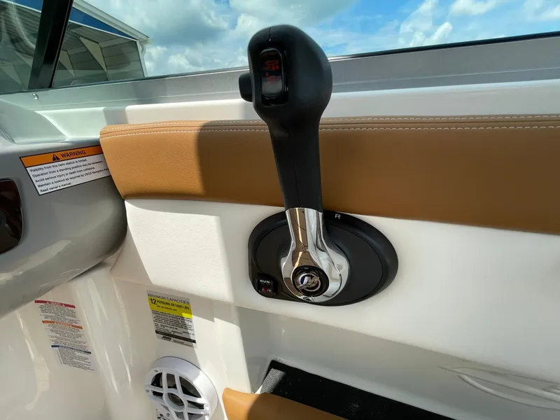 Slide: The Image of 2026 Chaparral 21 SSi boat interior with stylish seating and wood-patterned flooring. - 25