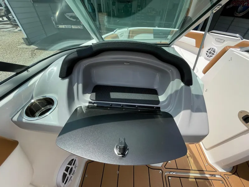 Slide: The Image of 2026 Chaparral 21 SSi boat interior with stylish brown and white seating. - 29