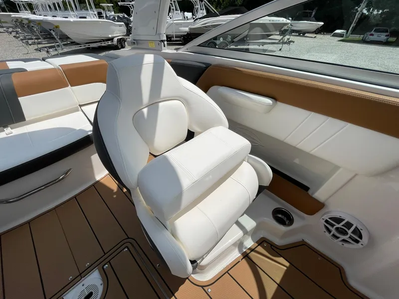 Slide: The Image of 2026 Chaparral 21 SSi boat interior with stylish brown and white seating. - 31
