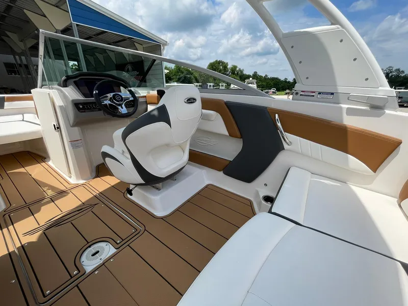 Slide: The Image of 2026 Chaparral 21 SSi boat interior with stylish brown and white seating. - 33