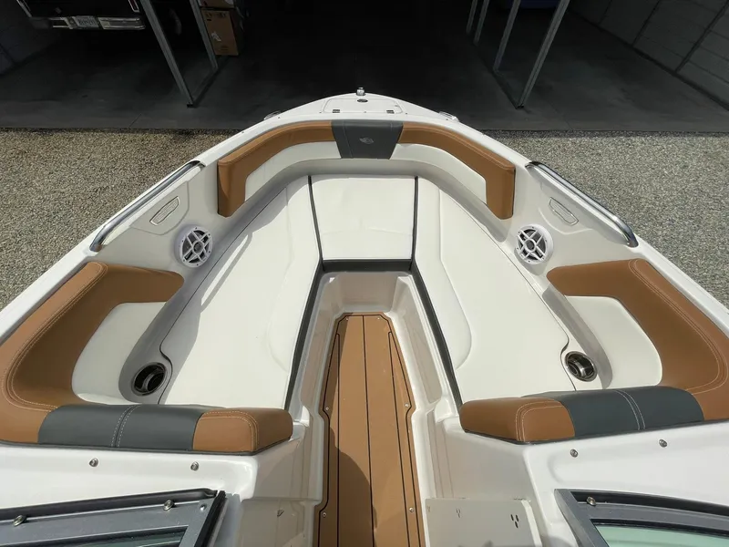 Slide: The Image of 2026 Chaparral 21 SSi boat side view with sleek black and white design. - 4