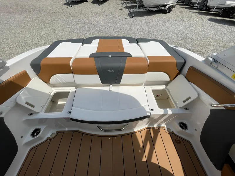 Slide: The Image of 2026 Chaparral 21 SSi boat deck with warning labels and chrome fixtures. - 40