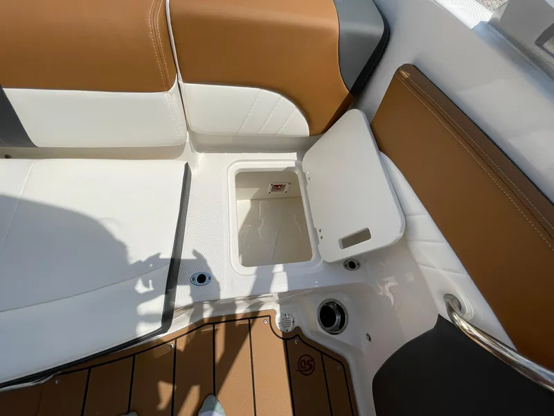 Slide: The Image of 2026 Chaparral 21 SSi boat with "Extended Plane" emblem on white surface. - 41