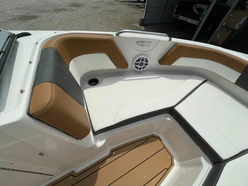 Slide: The Image of 2026 Chaparral 21 SSi emblem on boat exterior, showcasing sleek design. - 5