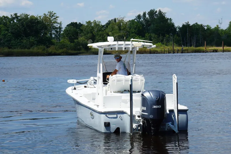 Slide: The Image of 2018 Seahunt BX25 boat with Yamaha 300 engine on a calm river. - 3