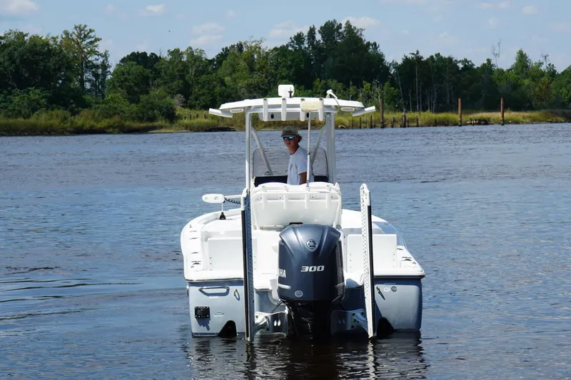 Slide: The Image of 2018 Seahunt BX25 boat with Yamaha 300 engine on a calm river. - 4