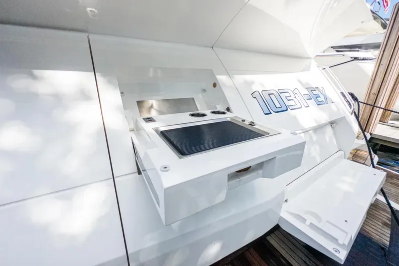 Slide: The Image of 2020 Sunseeker Predator 74 yacht with outdoor grill and sleek design. - 22