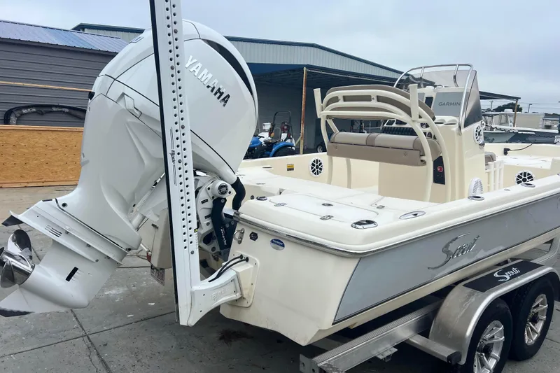 Slide: The Image of 2010 Scout 221 Winyah Bay boat with Yamaha outboard motor on trailer. - 2