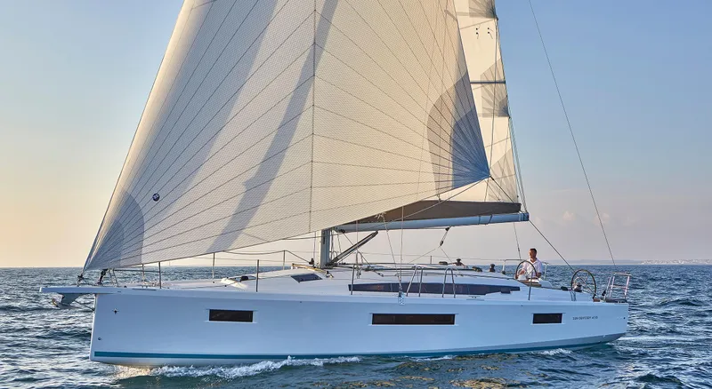 The Image of 2026 Jeanneau 410 sailboat cruising on open water under clear skies. - 0