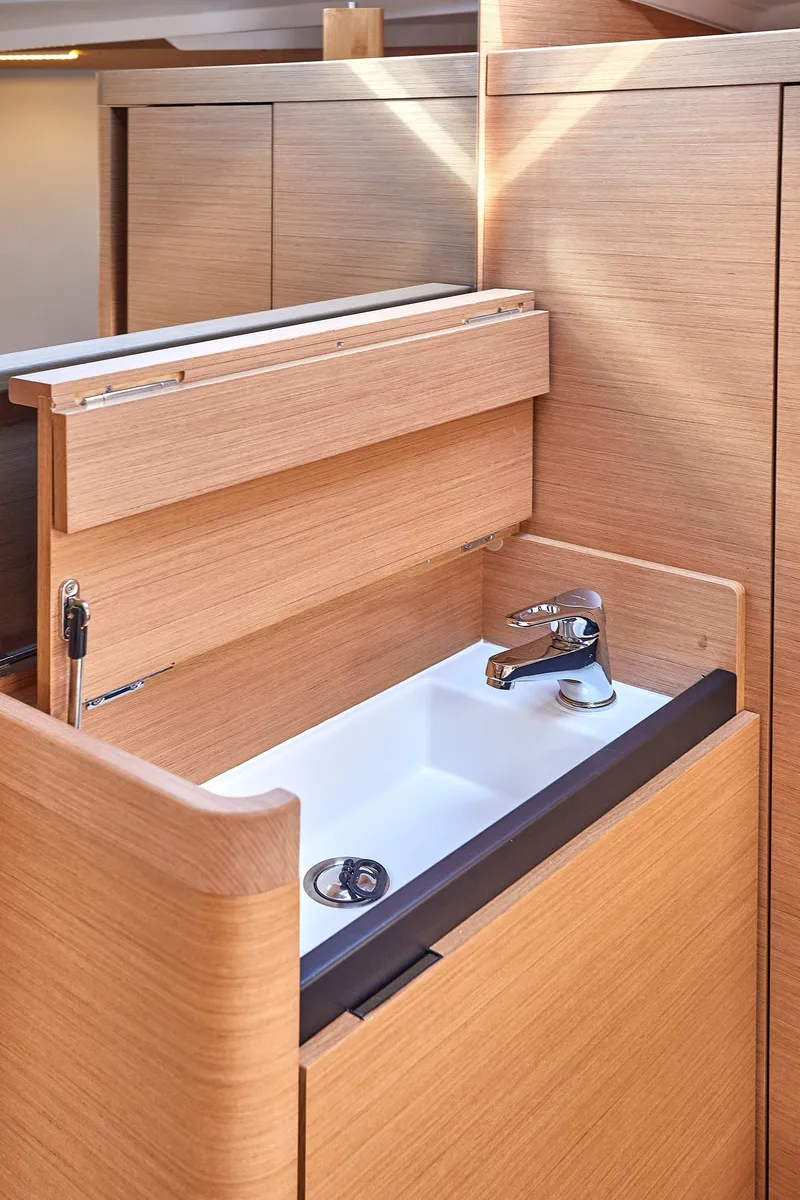 Slide: The Image of Modern sink in 2026 Jeanneau 410 yacht with sleek wooden cabinetry. - 22