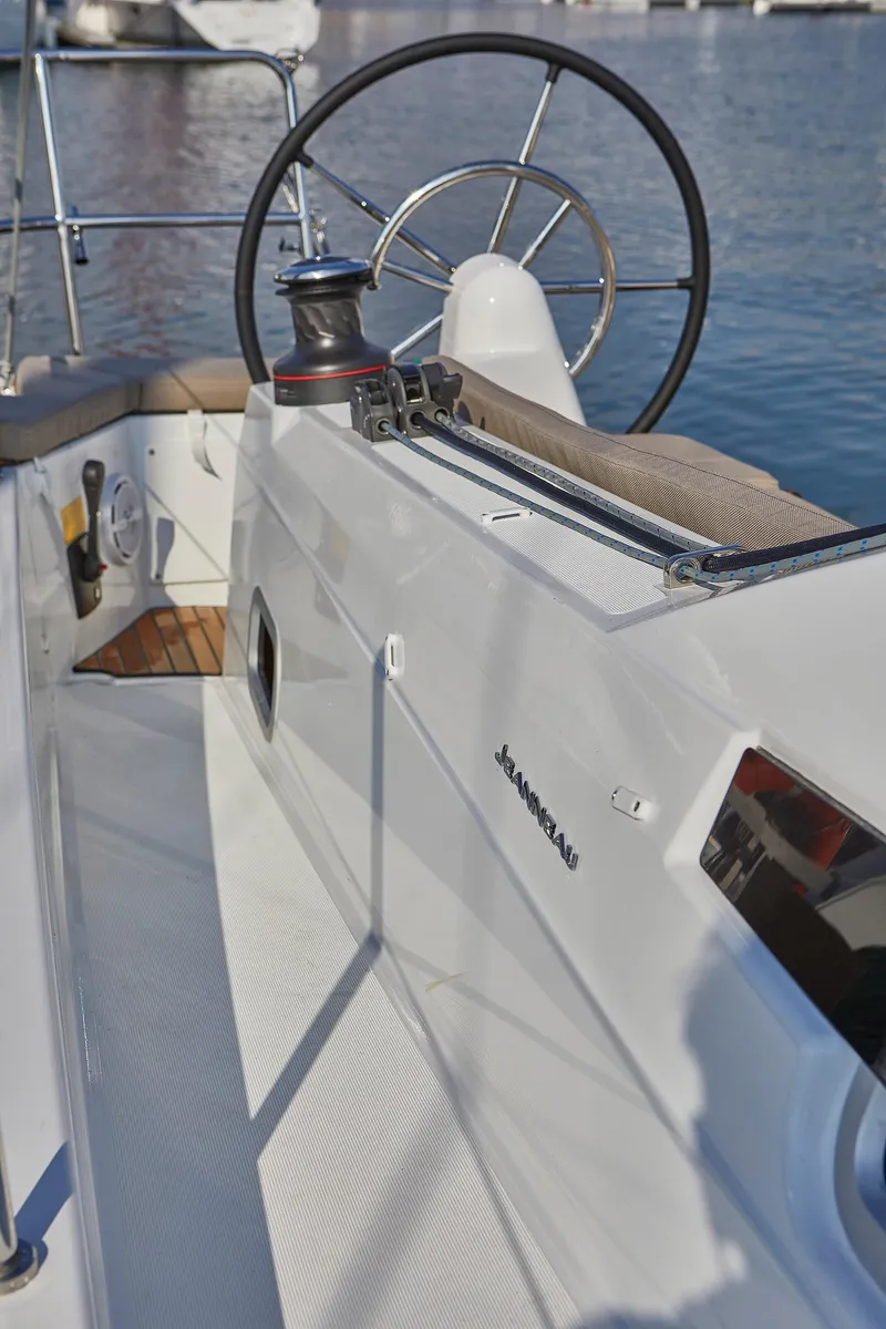 Slide: The Image of 2026 Jeanneau 410 yacht cockpit with steering wheel, winch, and sleek design. - 8