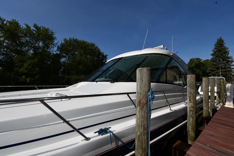 Slide: The Image of 2007 Formula 45 Yacht docked, surrounded by trees and clear blue sky. - 1