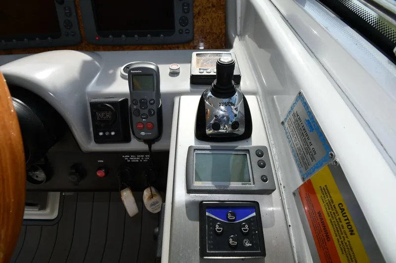 Slide: The Image of Control panel of a 2007 Formula 45 Yacht with navigation and joystick controls. - 13