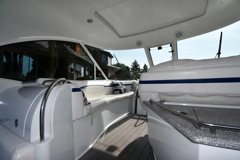 Slide: The Image of Interior of a 2007 Formula 45 Yacht with white seating and modern design. - 18