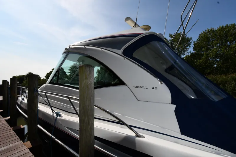 Slide: The Image of 2007 Formula 45 Yacht docked, showcasing sleek design and modern features. - 2