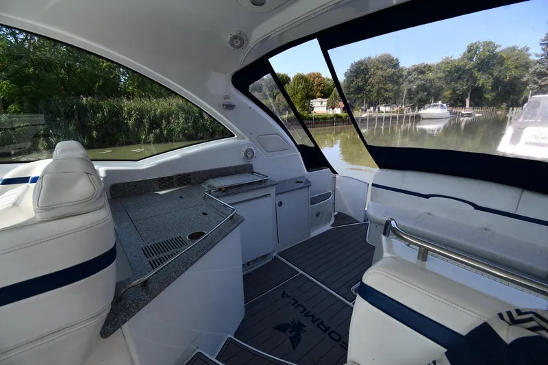 Slide: The Image of Interior view of 2007 Formula 45 Yacht with sleek seating and scenic waterway backdrop. - 20