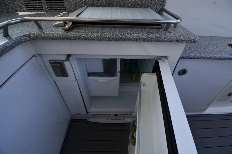 Slide: The Image of Open mini fridge on 2007 Formula 45 Yacht with granite countertop and storage. - 23