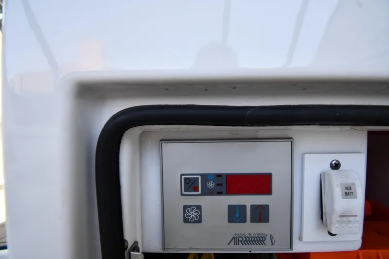 Slide: The Image of Control panel on a 2007 Formula 45 Yacht, featuring marine air systems. - 24