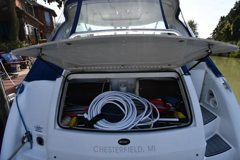 Slide: The Image of 2007 Formula 45 Yacht storage compartment open, docked in Chesterfield, MI. - 25