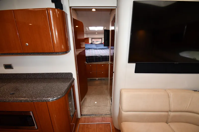 Slide: The Image of Interior of 2007 Formula 45 Yacht with modern kitchen and cozy bedroom. - 27