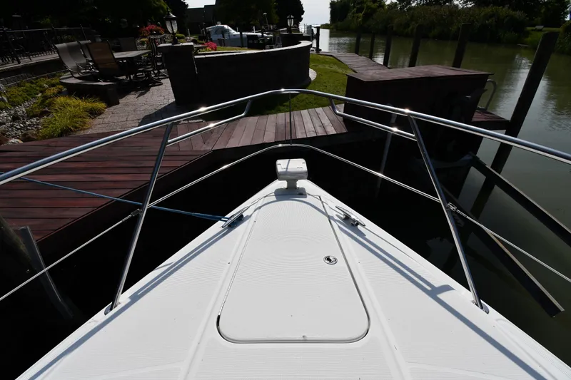Slide: The Image of Bow view of 2007 Formula 45 Yacht docked near a wooden pier. - 3