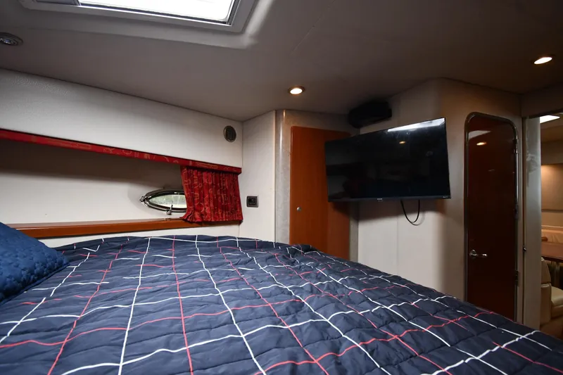 Slide: The Image of Interior of 2007 Formula 45 Yacht bedroom with bed, TV, and porthole window. - 32