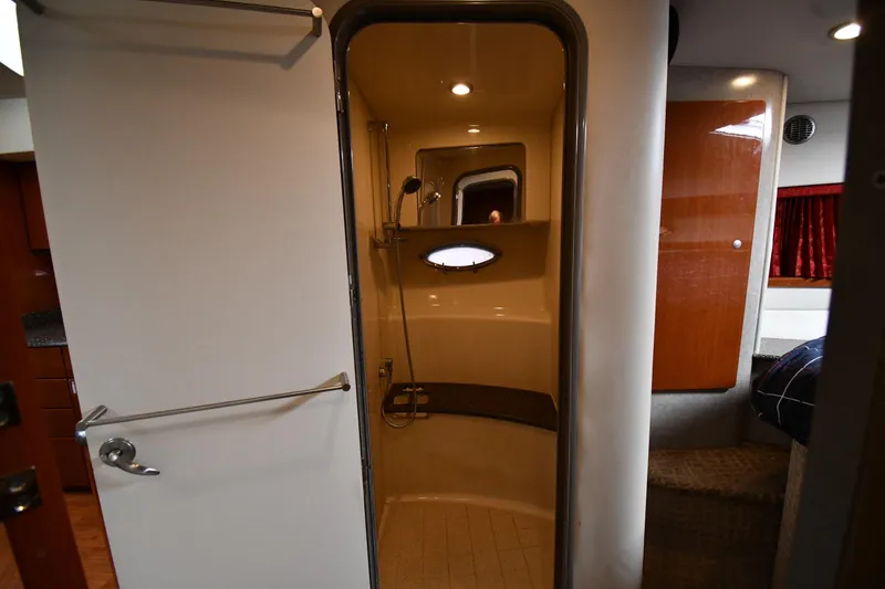 Slide: The Image of Interior of 2007 Formula 45 Yacht showing bathroom with shower and porthole window. - 35