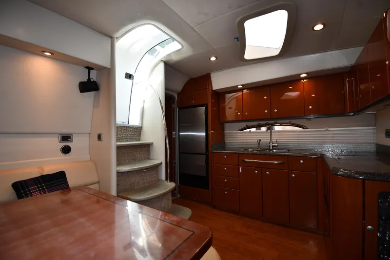 Slide: The Image of Interior of 2007 Formula 45 Yacht featuring modern kitchen and elegant wood cabinetry. - 39