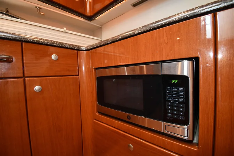 Slide: The Image of Luxury yacht kitchen with wood cabinetry and built-in microwave, Formula 45 Yacht 2007. - 43