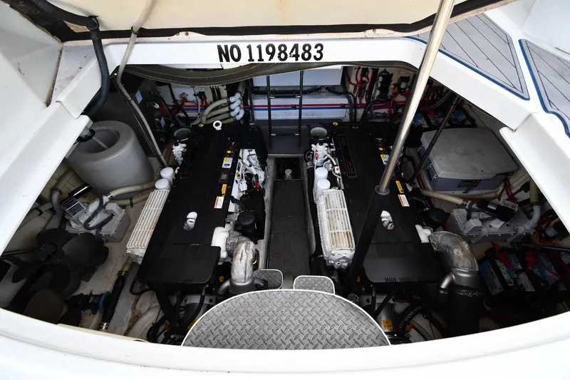 Slide: The Image of Engine room of a 2007 Formula 45 Yacht, showcasing dual engines and mechanical components. - 53