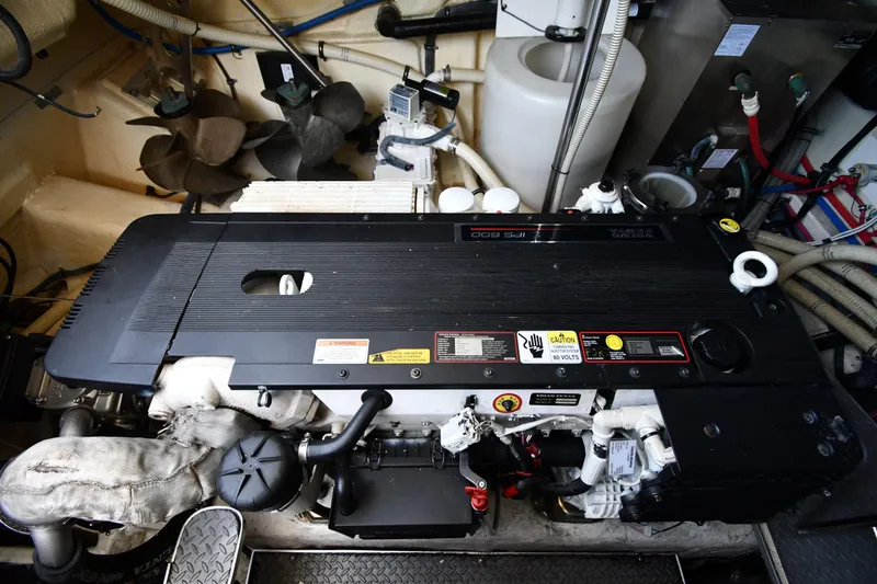 Slide: The Image of Engine room of a 2007 Formula 45 Yacht, featuring a Volvo Penta IPS 600 engine. - 54