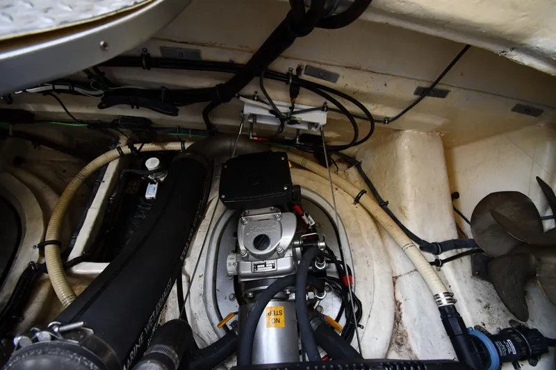 Slide: The Image of Engine room of a 2007 Formula 45 Yacht, showcasing mechanical components and wiring. - 60