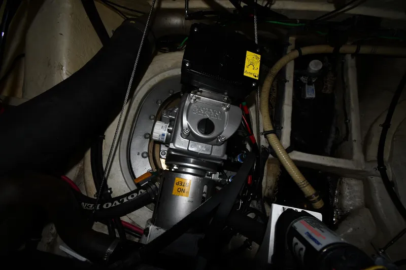 Slide: The Image of Engine compartment of a 2007 Formula 45 Yacht, showcasing mechanical components and hoses. - 61
