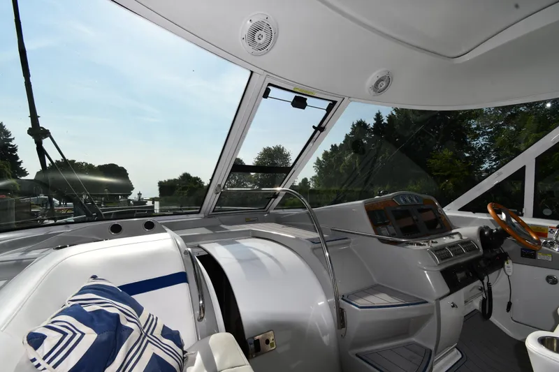 Slide: The Image of Interior view of 2007 Formula 45 Yacht cockpit with steering wheel and navigation controls. - 8