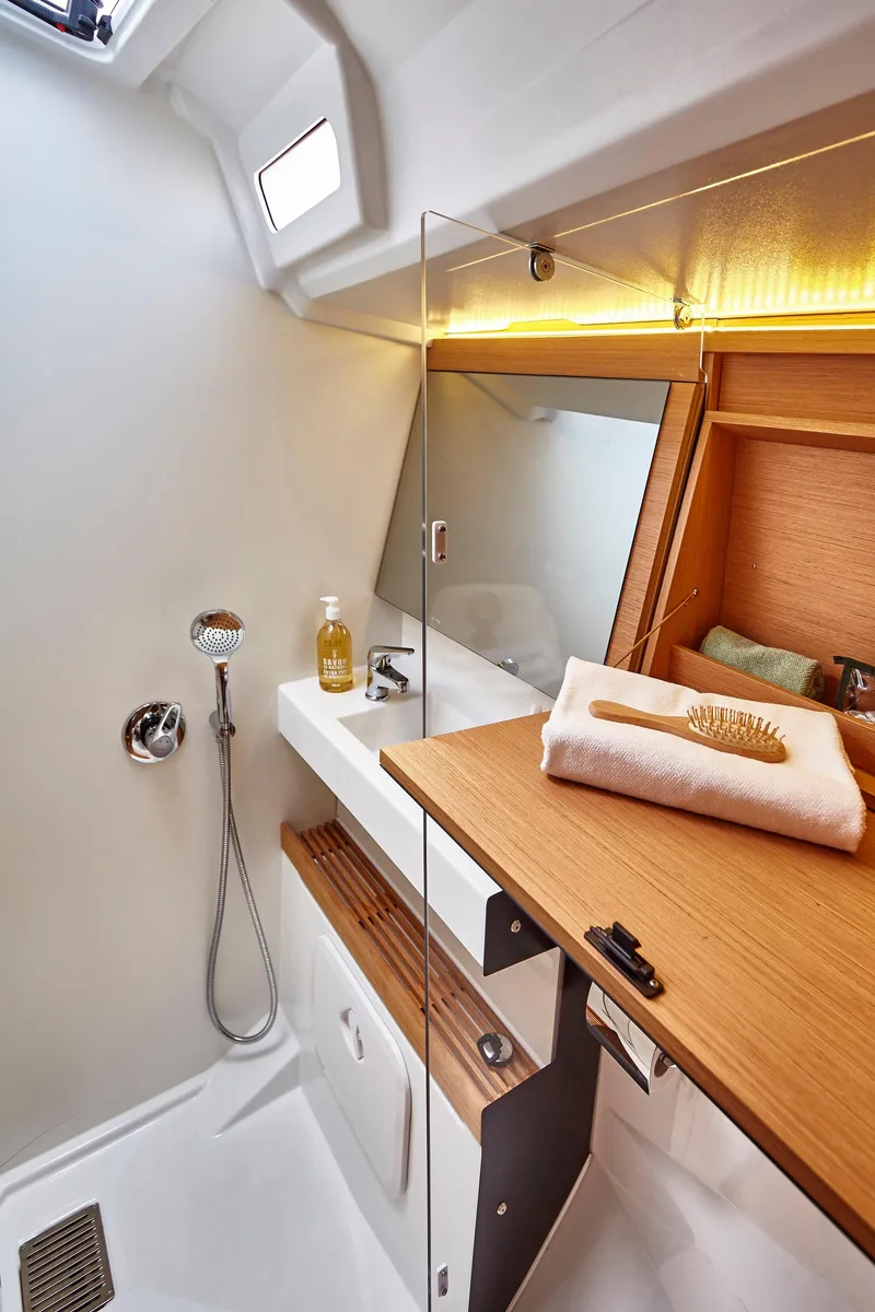 Slide: The Image of Modern bathroom in 2026 Jeanneau 440 yacht with sleek design and wooden accents. - 12