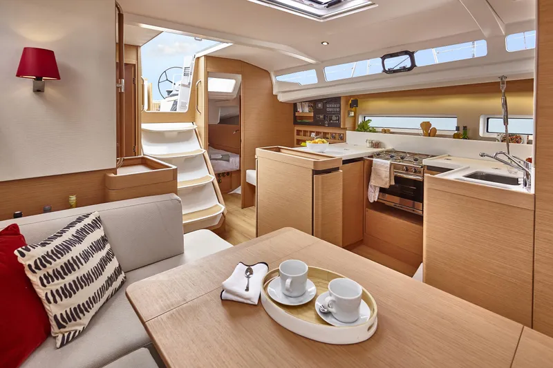 Slide: The Image of Luxurious interior of 2026 Jeanneau 440 yacht with modern kitchen and cozy seating area. - 15