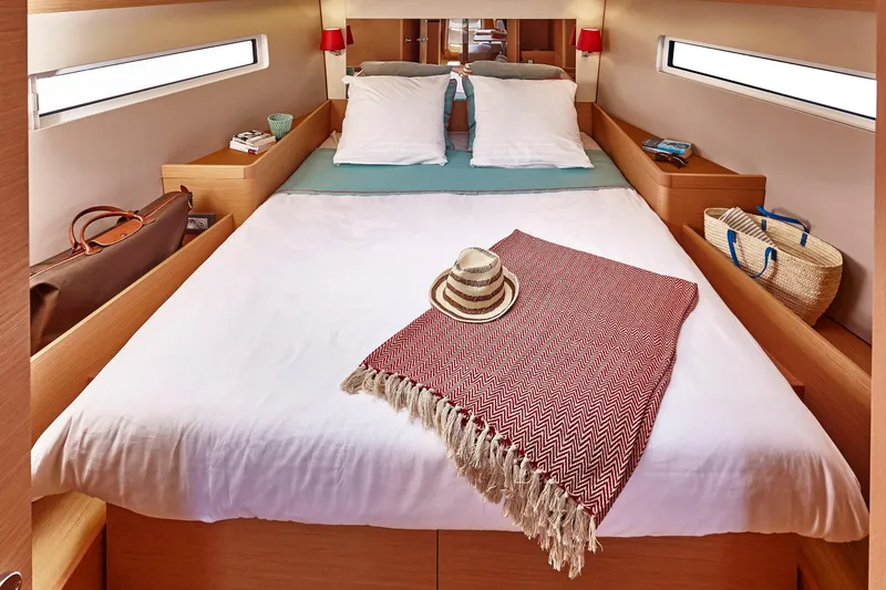 Slide: The Image of Luxurious cabin interior of 2026 Jeanneau 440 yacht with cozy bed and stylish decor. - 5