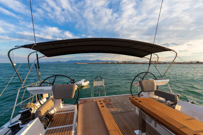 Slide: The Image of 2026 Jeanneau Yachts 60 sailing on open water under a clear sky. - 5