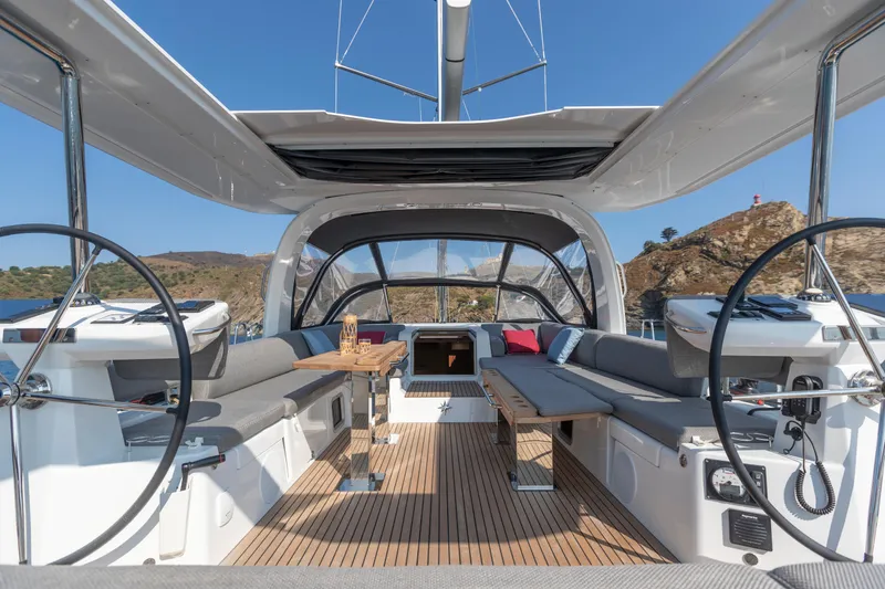 Slide: The Image of Luxurious Jeanneau Yachts 60 cockpit, 2026 model, featuring spacious seating and dual steering wheels. - 6