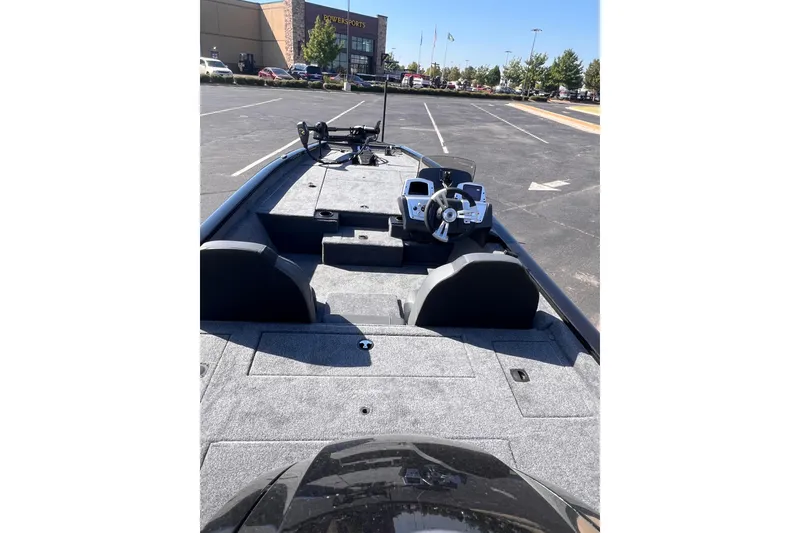 Slide: The Image of 2026 Tracker Pro Team 190 boat in parking lot, showcasing interior and steering console. - 5