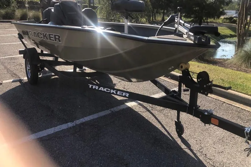 Slide: The Image of 2026 Tracker Pro Team 175 Crappie Edition boat on trailer in parking lot. - 11