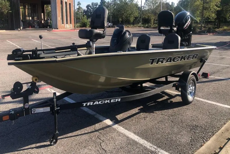 Slide: The Image of 2026 Tracker Pro Team 175 Crappie Edition boat on trailer in parking lot. - 5