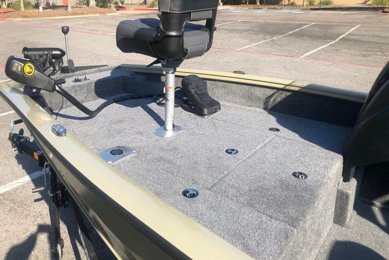 Slide: The Image of 2026 Tracker Pro Team 175 Crappie Edition boat with carpeted deck and swivel seat. - 7