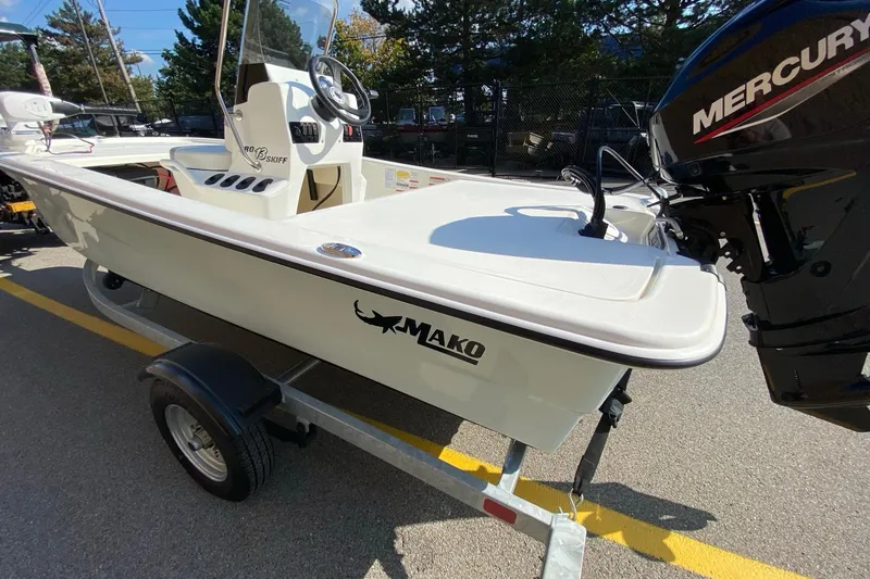 Slide: The Image of 2025 Mako Pro Skiff 13 CC boat on trailer with Mercury engine. - 3