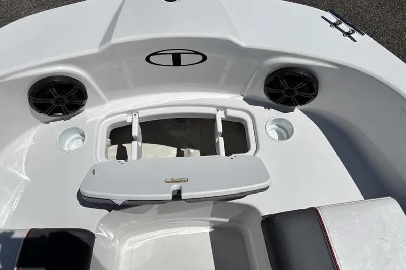 Slide: The Image of 2026 Tahoe T21 boat interior with storage compartment and speakers. - 11