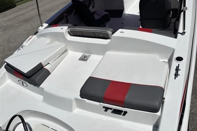 Slide: The Image of 2026 Tahoe T21 boat interior with red and gray seating, showcasing modern design. - 13