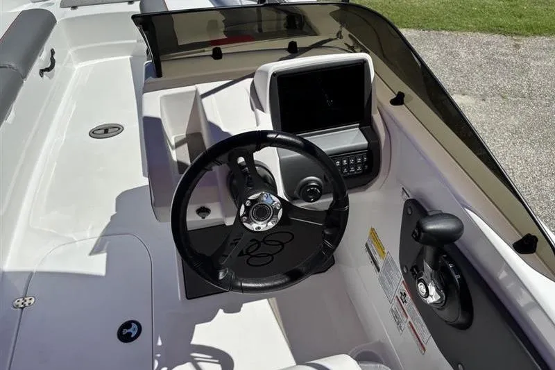 Slide: The Image of 2026 Tahoe T21 boat cockpit with steering wheel and control panel. - 7
