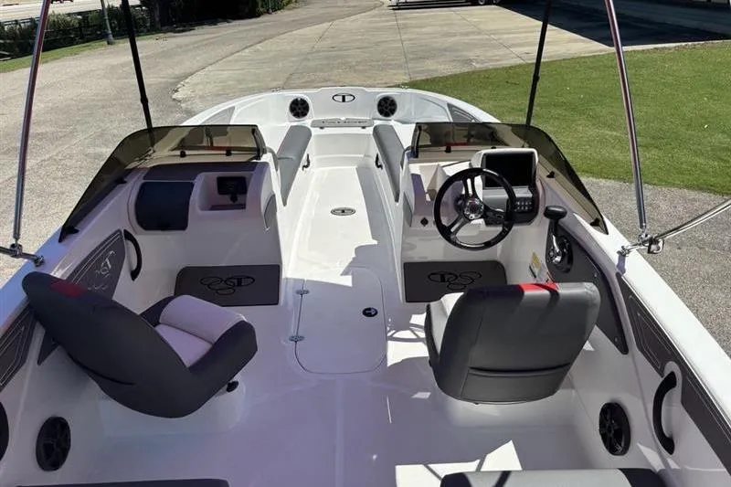 Slide: The Image of 2026 Tahoe T21 boat interior with dual seating and steering console. - 9