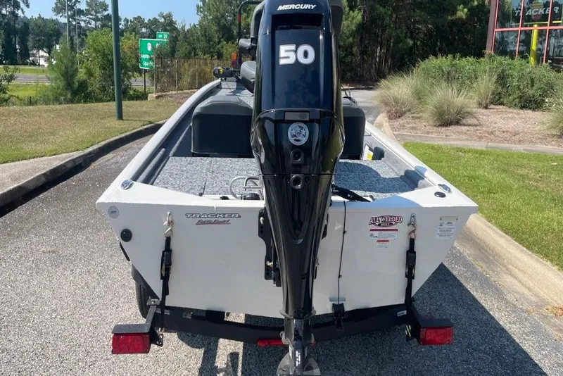 Slide: The Image of 2026 Tracker Pro 170 boat with Mercury 50 engine, parked outdoors. - 2