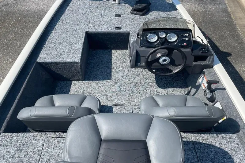 Slide: The Image of 2026 Tracker Pro 170 boat interior with gray seating and modern dashboard. - 4